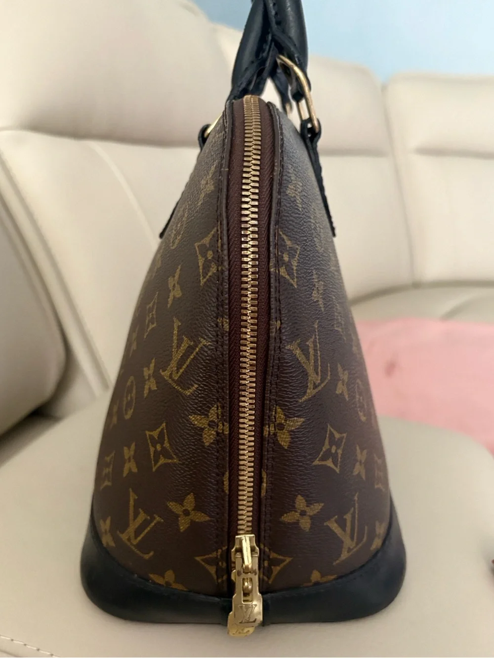 Louis Vuitton Monogram Canvas Alma in Brown with Black Trim